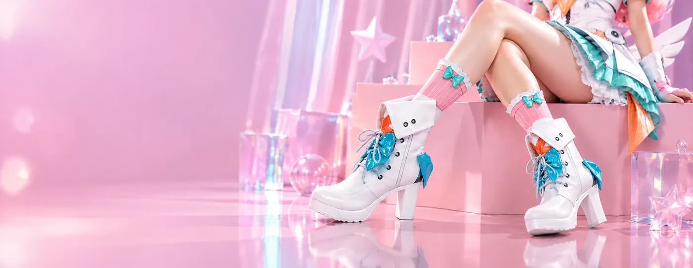White cosplay boots with turquoise details on a pink background