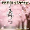 Mini $3.5\text{cm}$ Zenless Zone Zero acrylic phone charm featuring chibi illustrations of green-haired character Sunna with a black phone loop strap hook.