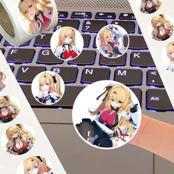 Close-up of circular Cissia character stickers being applied to a laptop keyboard for DIY styling.