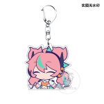 Several separate clear Zenless Zone Zero acrylic chibi keychains showing characters Irene and Nanomiya Yu pulling funny emoji expressions like pouting, crying from a chili pepper, and holding a microphone.