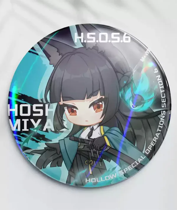 An acrylic chibi standee of Zenless Zone Zero character Hoshimi Miyabi with a sword alongside a portrait key chain charm and a round teal holographic badge with broad rainbow reflections.