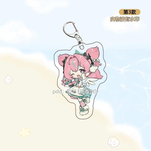 Three separate clear Zenless Zone Zero acrylic chibi keychains showing characters Cephora, Nanomiya Yu, and Irene as virtual angels with colorful wings and happy expressions.