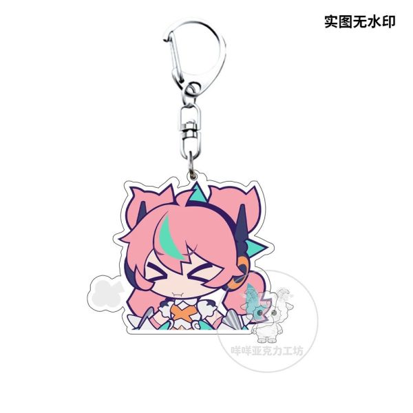 Several separate clear Zenless Zone Zero acrylic chibi keychains showing characters Irene and Nanomiya Yu pulling funny emoji expressions like pouting, crying from a chili pepper, and holding a microphone.