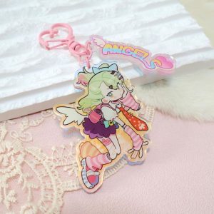 A collection of three retro 90s anime-style holographic acrylic keychains featuring Zenless Zone Zero characters reimagined as magical girls, complete with pink heart clasps and pastel "ANGELS" tags.