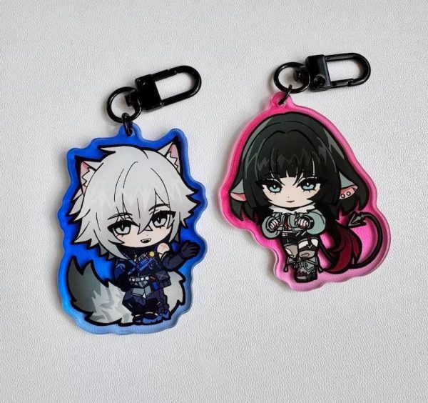 Two acrylic keychains featuring chibi anime illustrations of Seth Lowell with a blue border and Jane Doe with a pink border from Zenless Zone Zero, attached to black metal clasps.