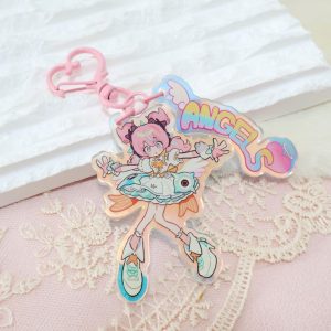 A collection of three retro 90s anime-style holographic acrylic keychains featuring Zenless Zone Zero characters reimagined as magical girls, complete with pink heart clasps and pastel "ANGELS" tags.