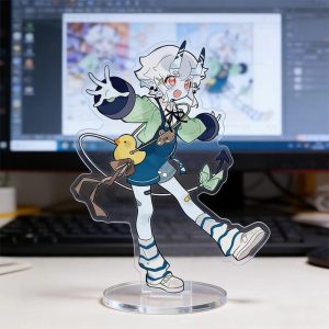 Clear acrylic desktop standees of cute Zenless Zone Zero characters in casual clothing standing on round transparent bases, displayed in front of a computer monitor on a desk.