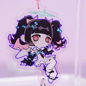A collection of three holographic acrylic keychains featuring Zenless Zone Zero characters Anby, Nekomata, and Nicole reimagined as magical angels, complete with pink star-shaped clasps and winged heart sub-charms, laid on a pink surface next to a laptop.