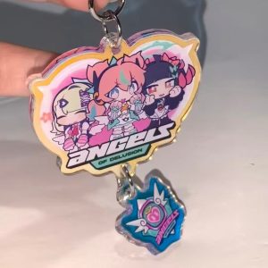 Selection of Zenless Zone Zero Angels of Delusion acrylic keychains, including a faceted heart-shaped gem block, a die-cut charm with a dangling logo, and a pink clasp keyring.