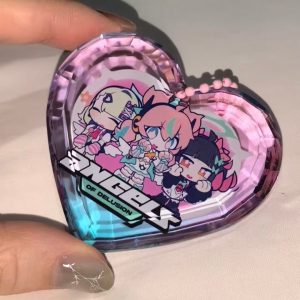 Selection of Zenless Zone Zero Angels of Delusion acrylic keychains, including a faceted heart-shaped gem block, a die-cut charm with a dangling logo, and a pink clasp keyring.