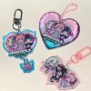 Selection of Zenless Zone Zero Angels of Delusion acrylic keychains, including a faceted heart-shaped gem block, a die-cut charm with a dangling logo, and a pink clasp keyring.