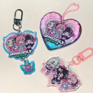 Selection of Zenless Zone Zero Angels of Delusion acrylic keychains, including a faceted heart-shaped gem block, a die-cut charm with a dangling logo, and a pink clasp keyring.